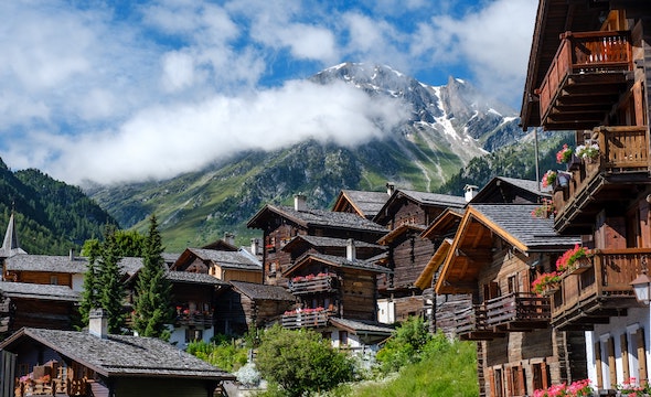 Traditional Swiss chalet surrounded by snow